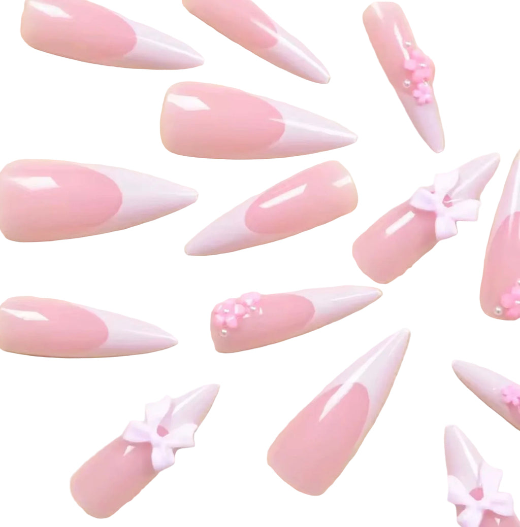 24 pieces of long, pointed armor-style white french tips with pink bow nail set