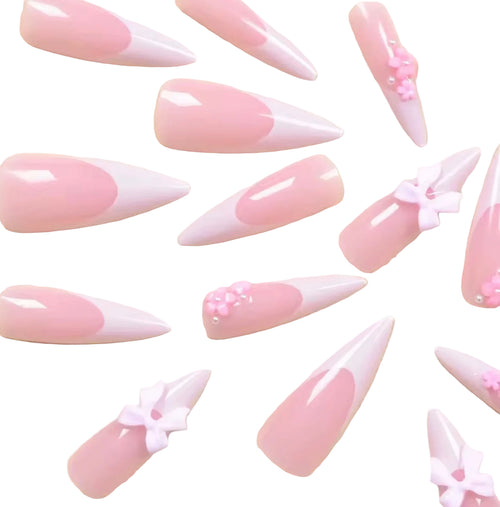 24 pieces of long, pointed armor-style white french tips with pink bow nail set