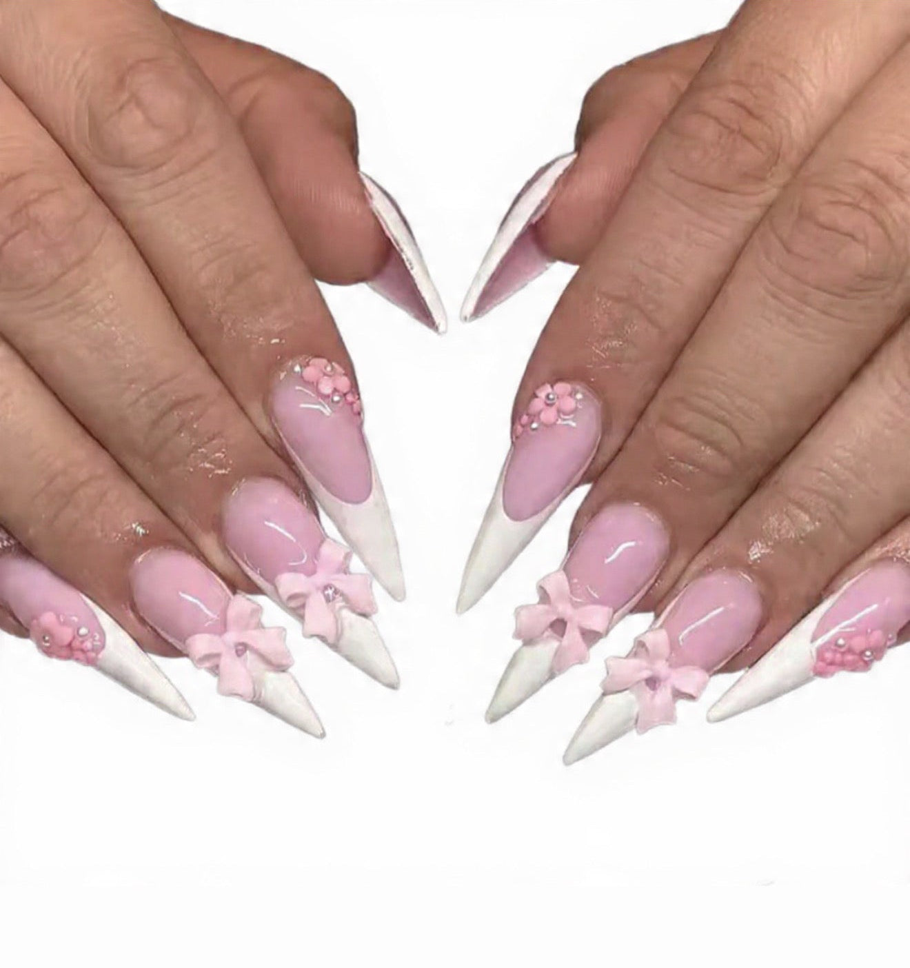 24 pieces of long, pointed armor-style white french tips with pink bow nail set